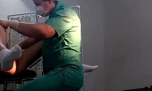 A catholic in white socks on a gynecological chair