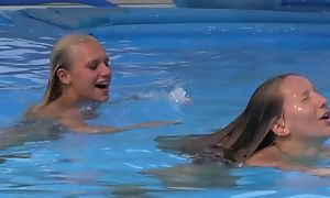 Two beautiful girls swimming coupled with licking by the come together